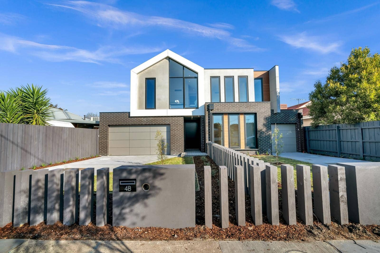 Photo by R ARCHITECTURE white and brown concrete building under blue sky during daytime